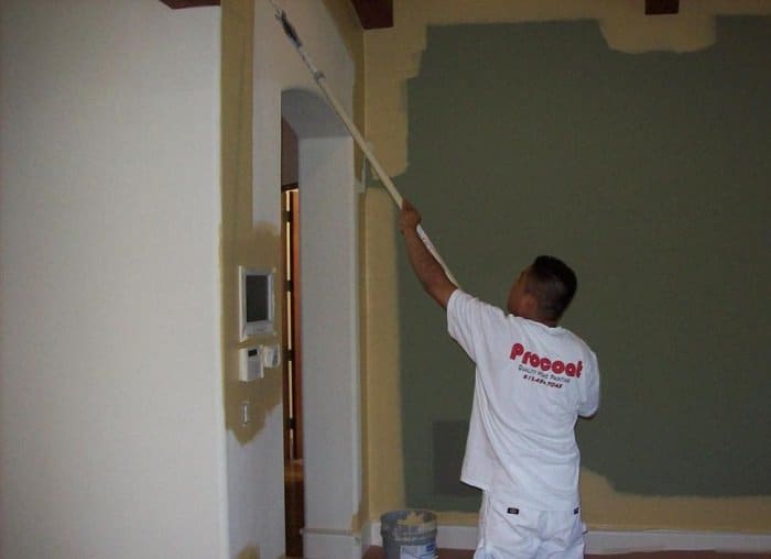 Action Shot of Rolling an Interior Painting Project