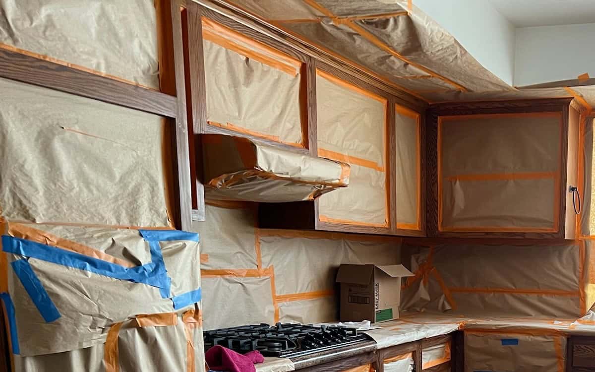 painting over stained wood cabinets 1